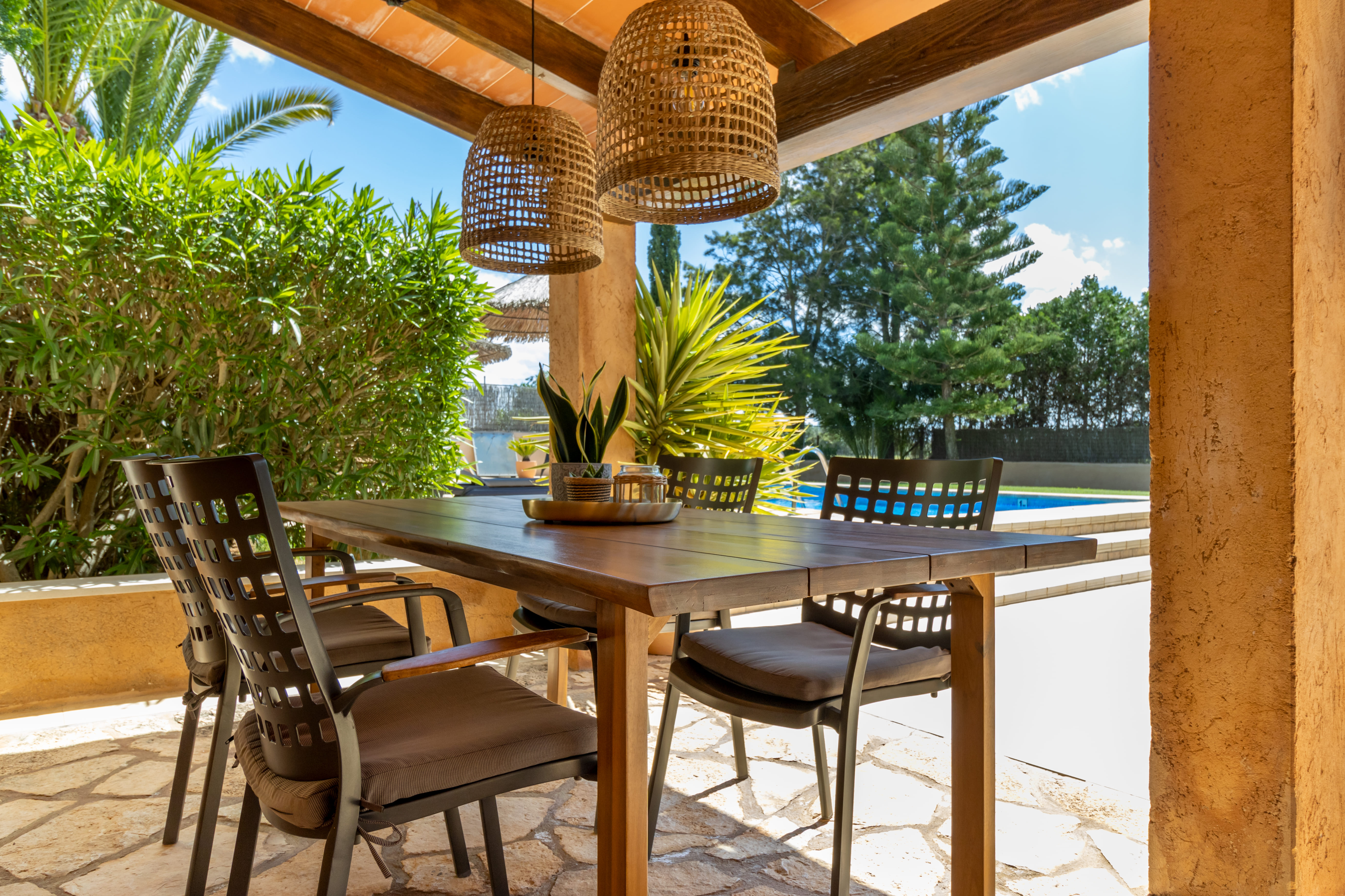 Shaded porch dining with pool view